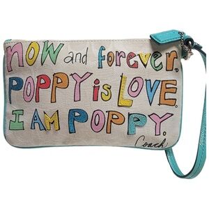 Coach Poppy Woodmark Multicolor Text Wristlet with Teal Accents.